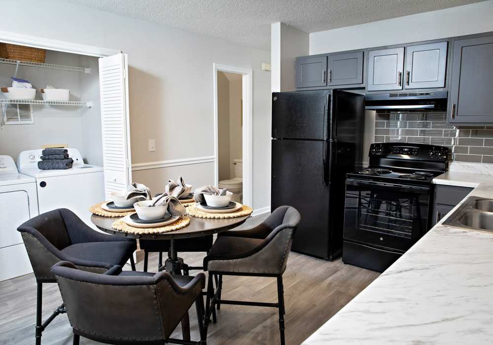 Dining room with close access to fully-equipped kitchen at Edge at Concord in Concord, North Carolina