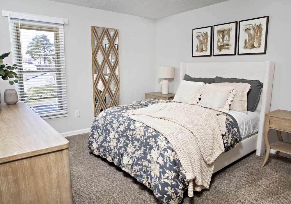 Spacious bedroom with large comfortable bed at Edge at Concord in Concord, North Carolina, 