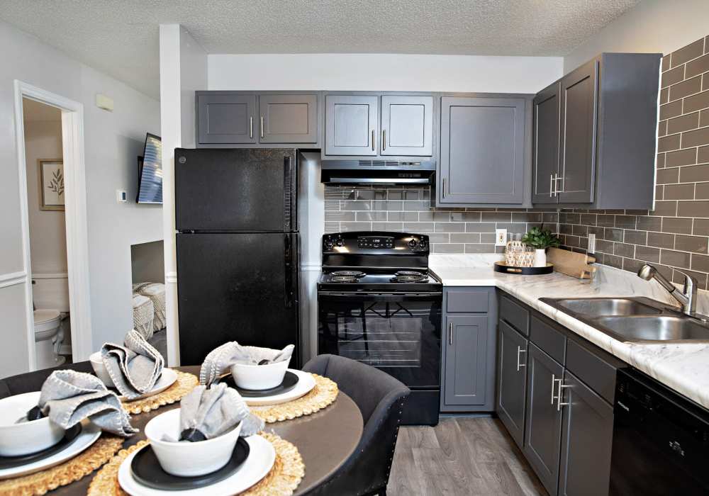 View of fully equipped kitchen and marble countertops at Edge at Concord in Concord, North Carolina, 