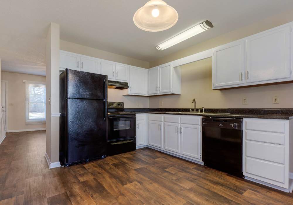 Spacious kitchen with wood-style flooring at Edge at Concord in Concord, North Carolina, 
