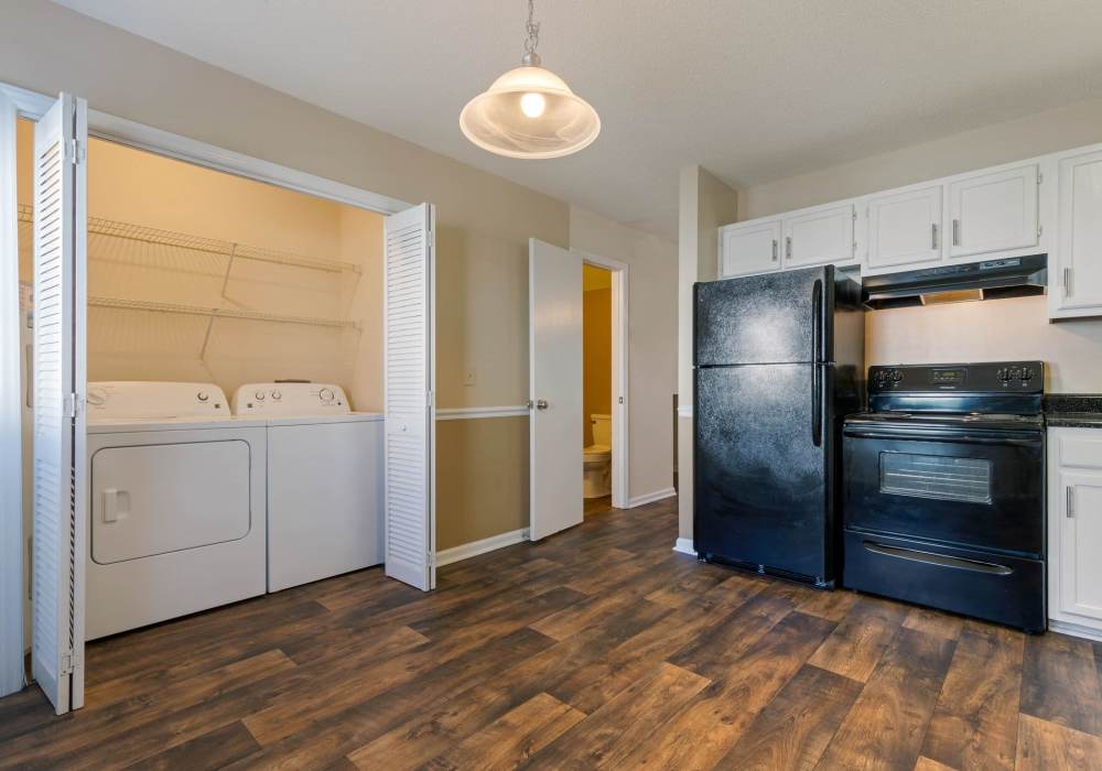 In-home washer and dryer with easy access from kitchen at Edge at Concord in Concord, North Carolina, 