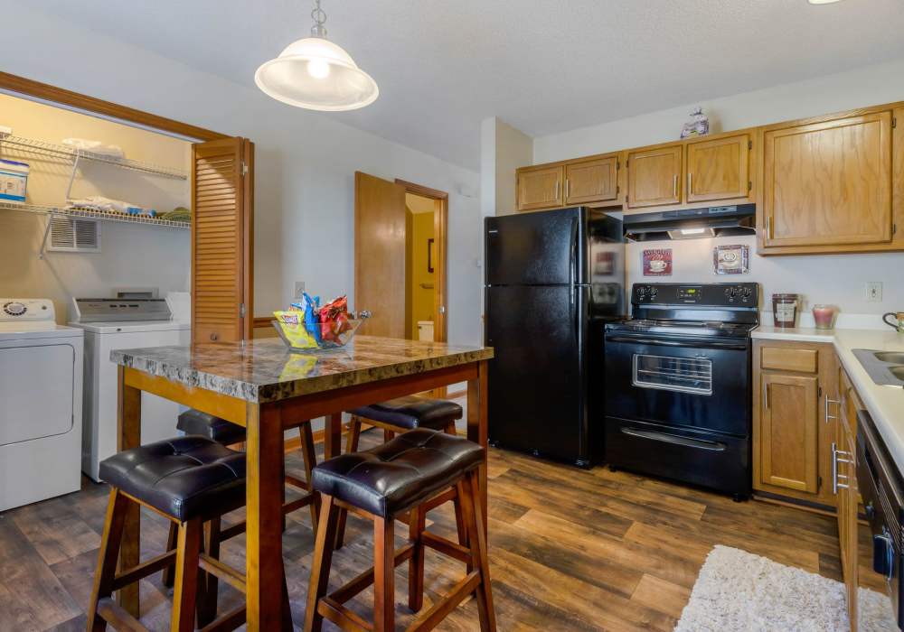 Dining table in the fully equipped kitchen at Edge at Concord in Concord, North Carolina, 