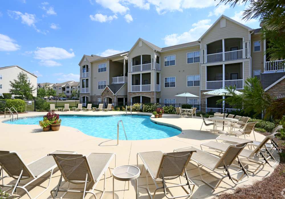 Lounge chairs by the pool at Highland Hills Apartments in Dothan, Alabama