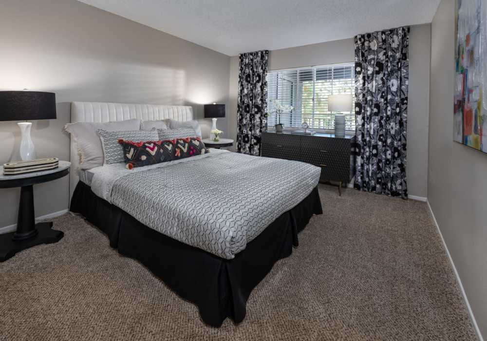 Bright bedroom with large windows at The Bluffs in Rancho Cucamonga, California,