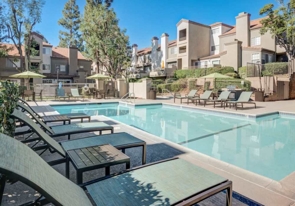 Swimming pool with lounge beds at The Bluffs in Rancho Cucamonga, California,