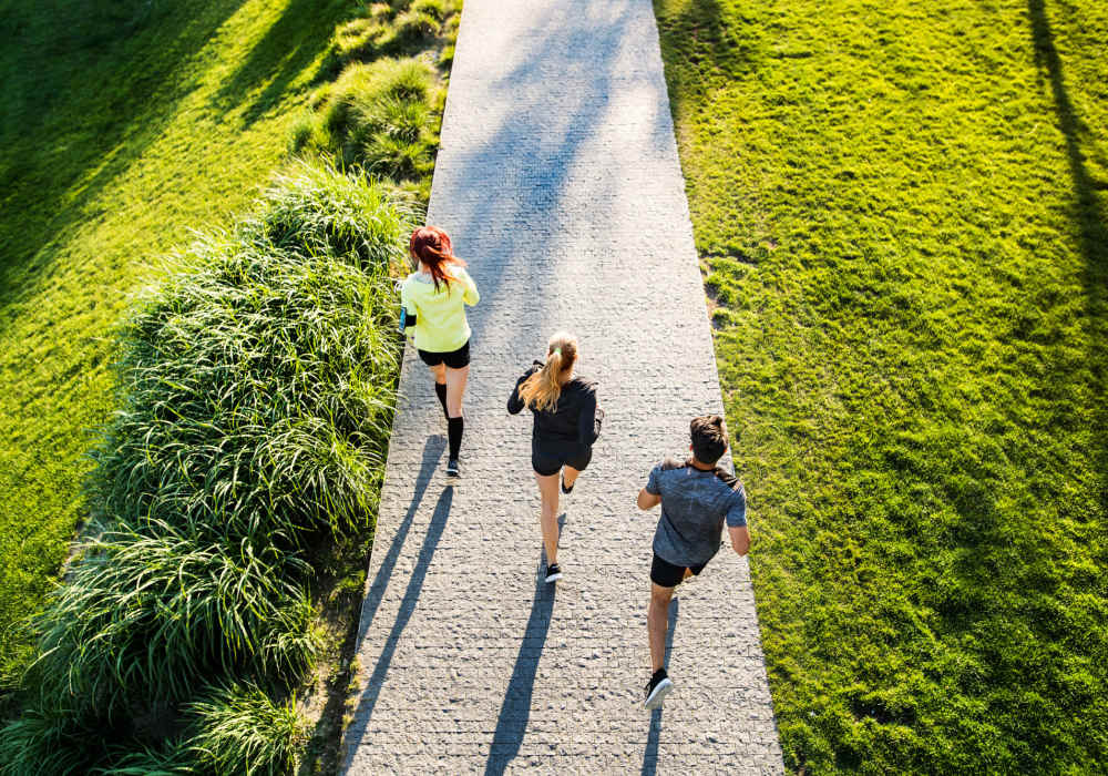 Friends going for a run in the park nearby The Bluffs in Rancho Cucamonga, California