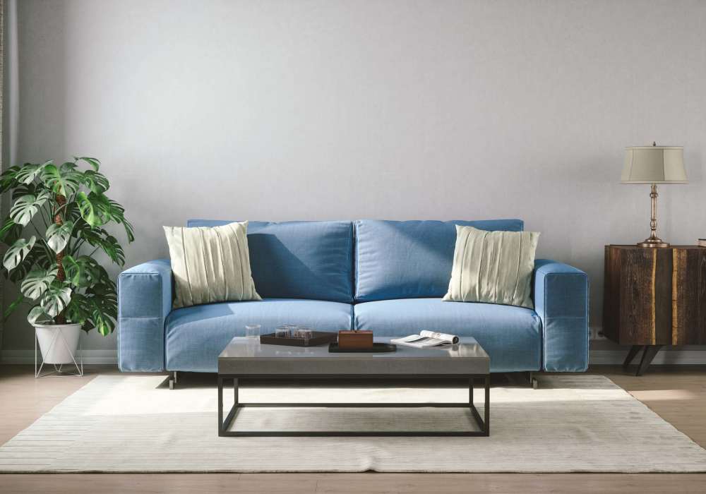 Living room with blue color sofa at Greer Mill Residences in Greer, South Carolina