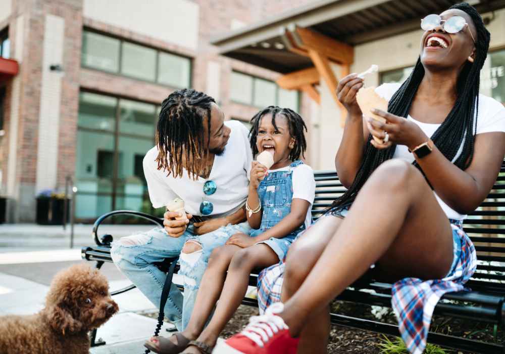 Resident family seating outside in street near Greer Mill Residences in Greer, South Carolina