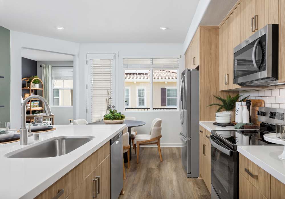 Kitchen with white cabinetry at Vida at Mountain House in Mountain House, California