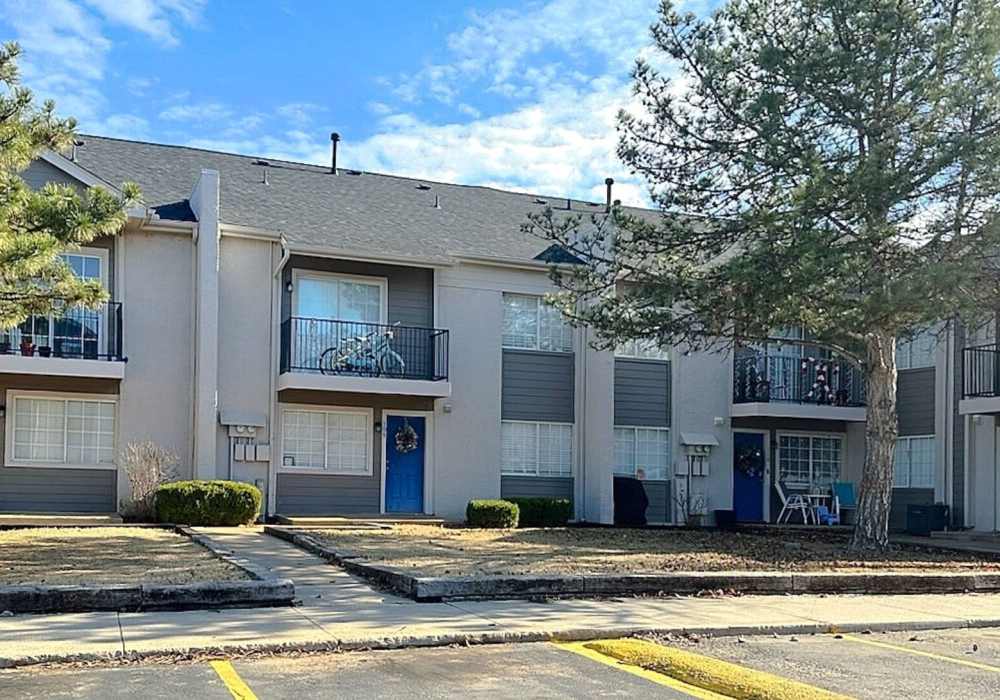 Resident playing with her dog at Lake Hefner Townhomes in Oklahoma City, Oklahoma