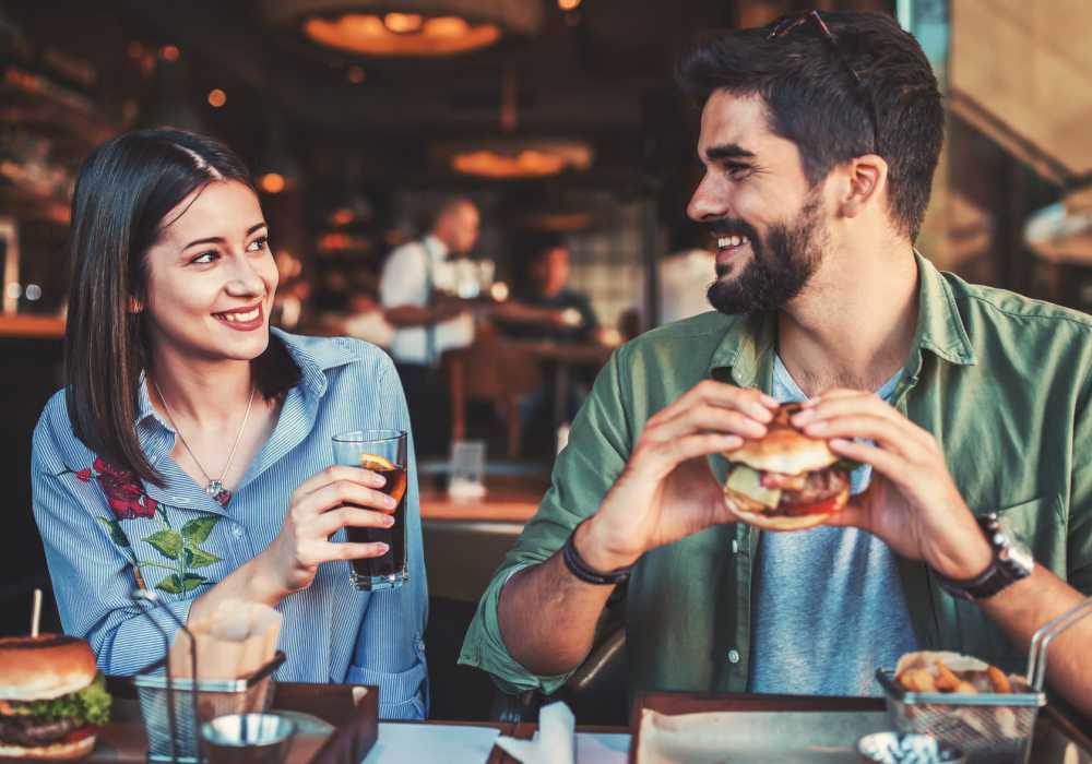 Resident couple having burger near Bridges at San Ramon in San Ramon, California,