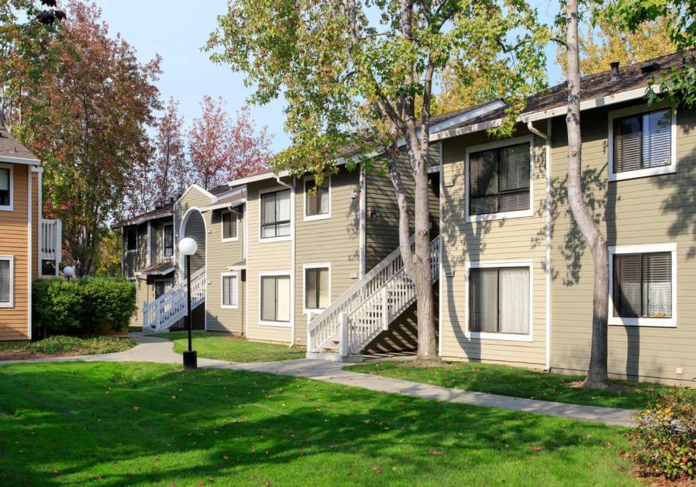 Community view with green lawn at Amber Court in Fremont, California