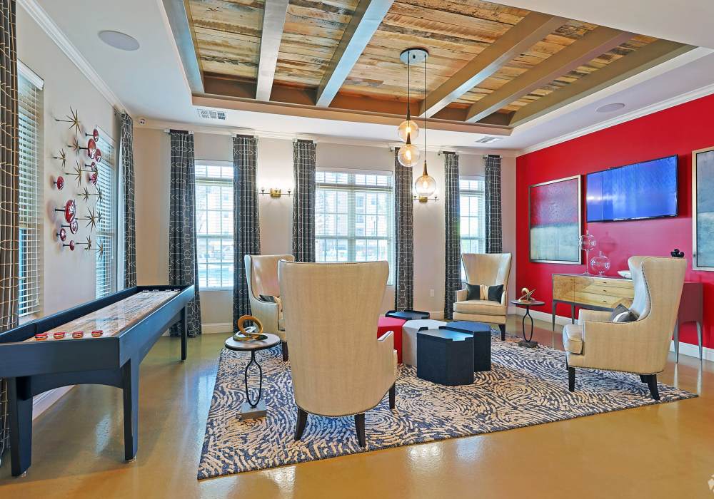 Modern clubhouse with cozy conversation area in Hollybrook Ranch in Round Rock, Texas
