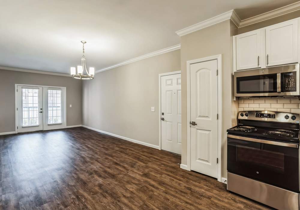 Empty Dining Area with Kitchen at Carroll at Cane Ridge Apartments in Antioch, Tennessee
