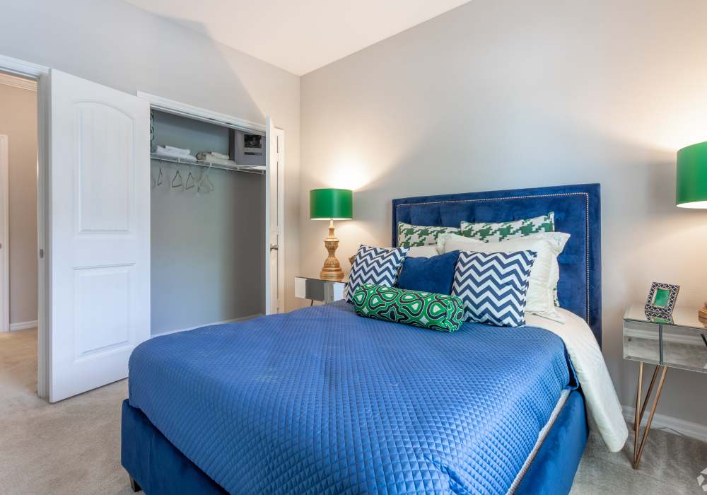 Carpeted guest bedroom at Village at Town Center in Raleigh, North Carolina