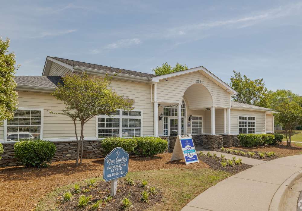 Green lawn and sign outside of leasing office at River Landing in Myrtle Beach, South Carolina