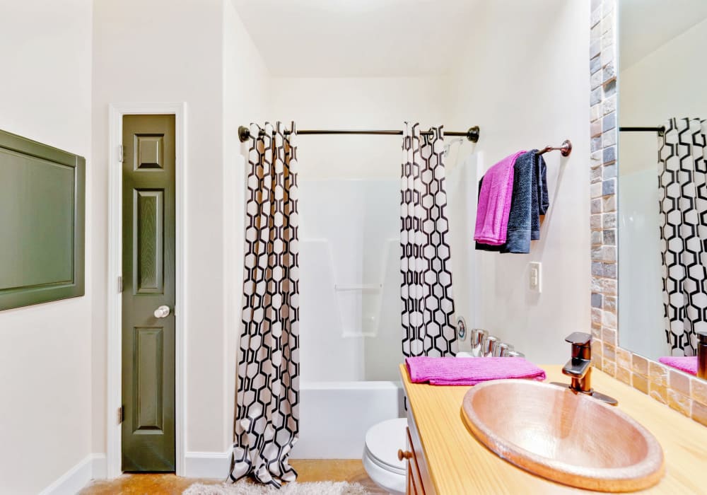 Bathroom and painted concrete flooring CityView Apartments in Greensboro, North Carolina.