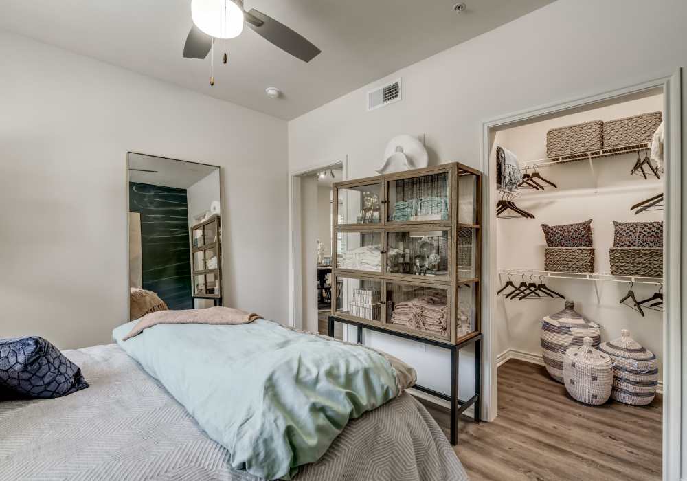 Modern bedroom with closet at Serene at La Villita in Irving, Texas