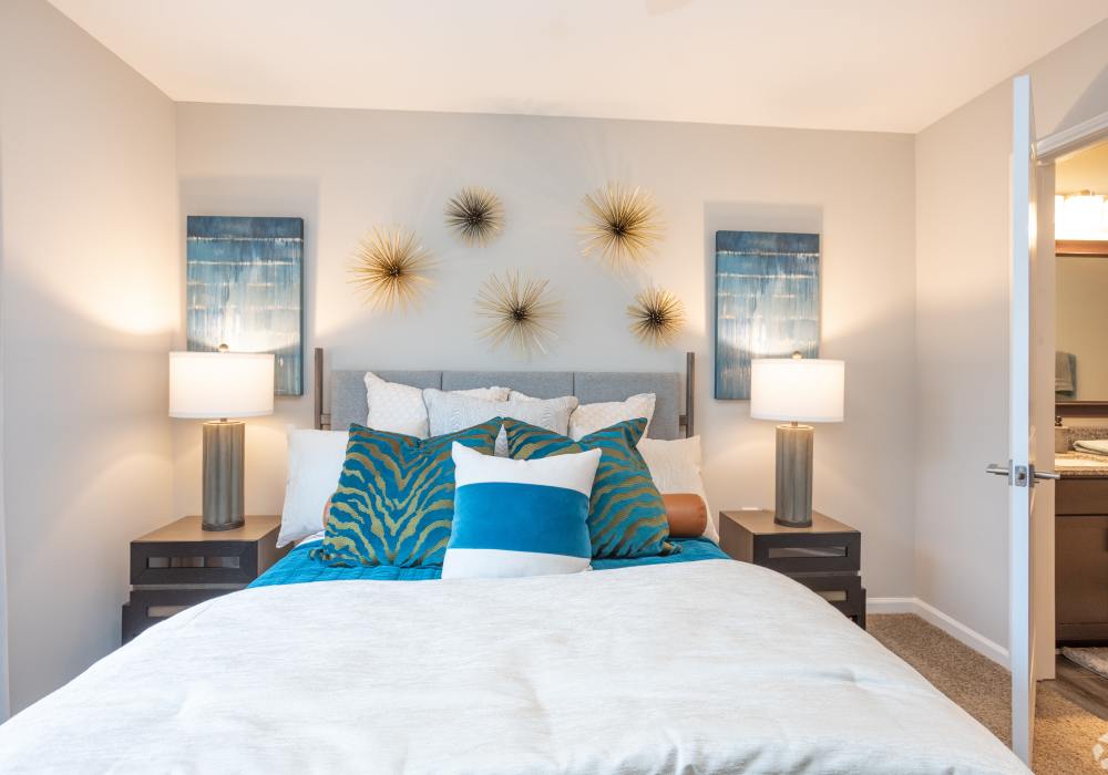 Bright and spacious modern bedrooms with ceiling fan closet bathroom at Featherstone in Durham, North Carolina