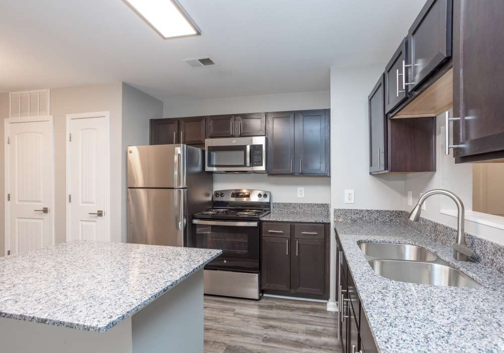 Modern kitchen with granite countertops at Featherstone in Durham, North Carolina