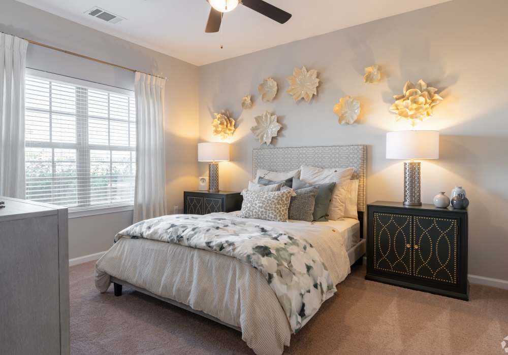 Modern bedroom with side lamps at Edenbrook Ridge in Pflugerville, Texas