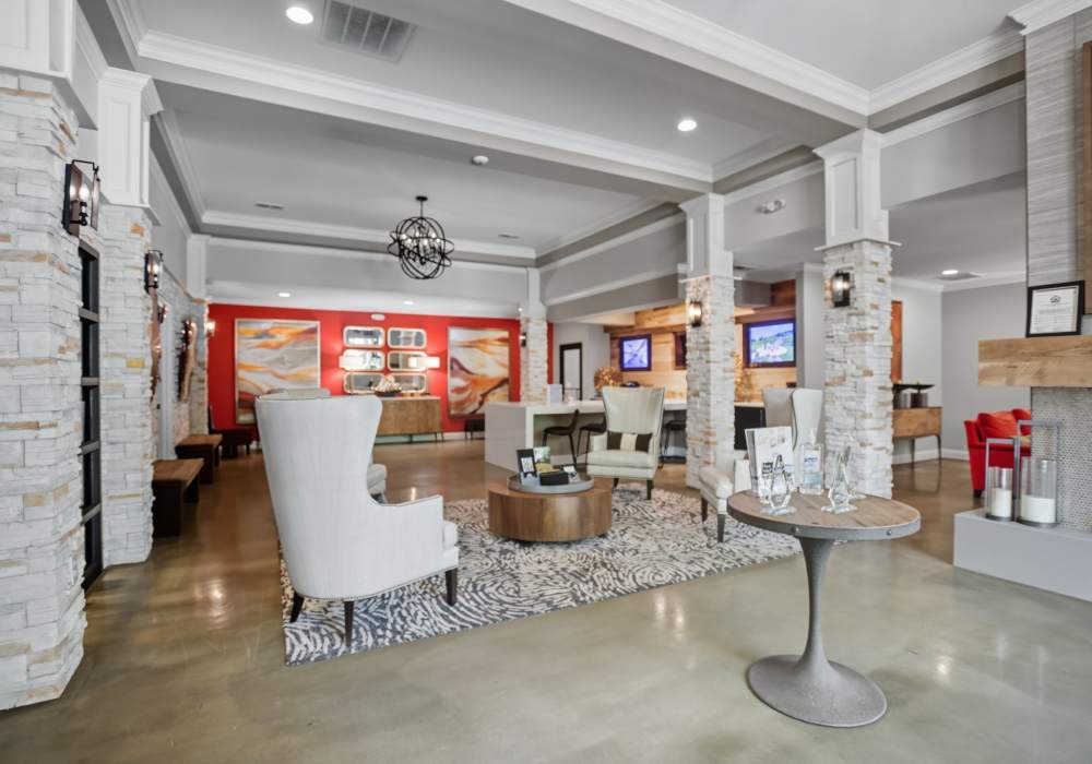 Clubhouse lounge area with shuffleboard and chairs at Ascot Point Village in Asheville, North Carolina