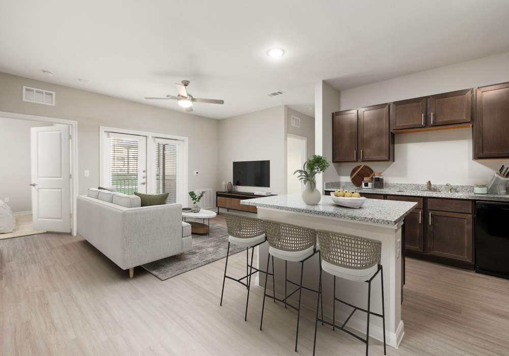 Combined view of the living room and the dining area at Walnut Springs in Seguin, Texas