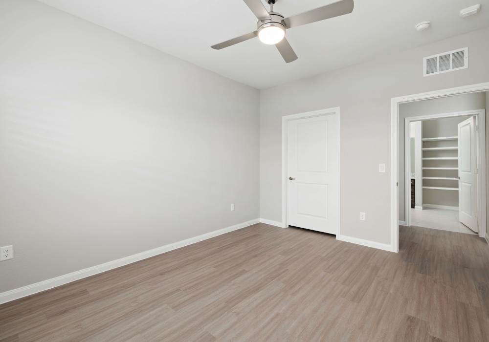 Bedroom with wooden flooring at Walnut Springs in Seguin, Texas