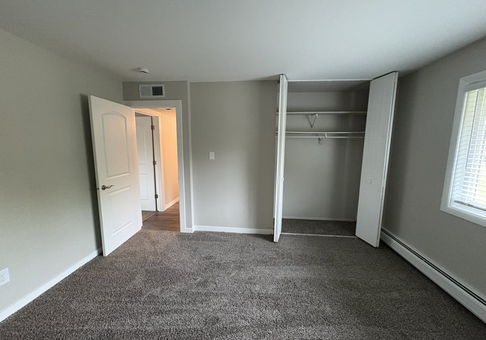 Unfurnished bedroom with window at Broadway Crossing Apartments in Merrillville, Indiana