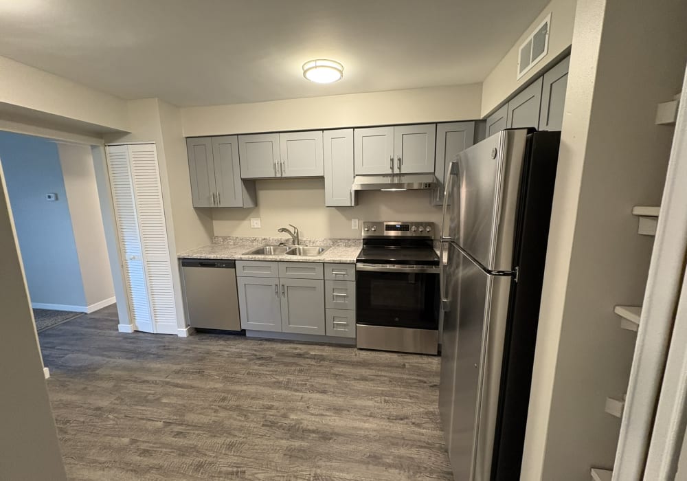 Kitchen with Stainless-steel appliances at Broadway Crossing Apartments in Merrillville, Indiana