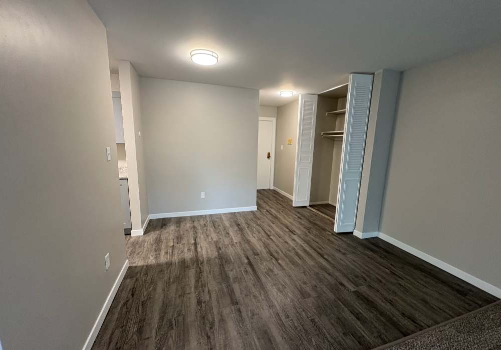Dining area with wooden flooring at Broadway Crossing Apartments in Merrillville, Indiana