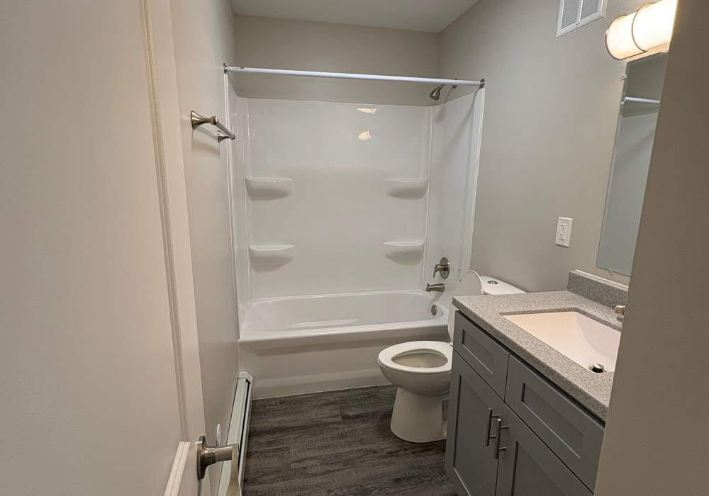 Bathroom with bathtub at Broadway Crossing Apartments in Merrillville, Indiana