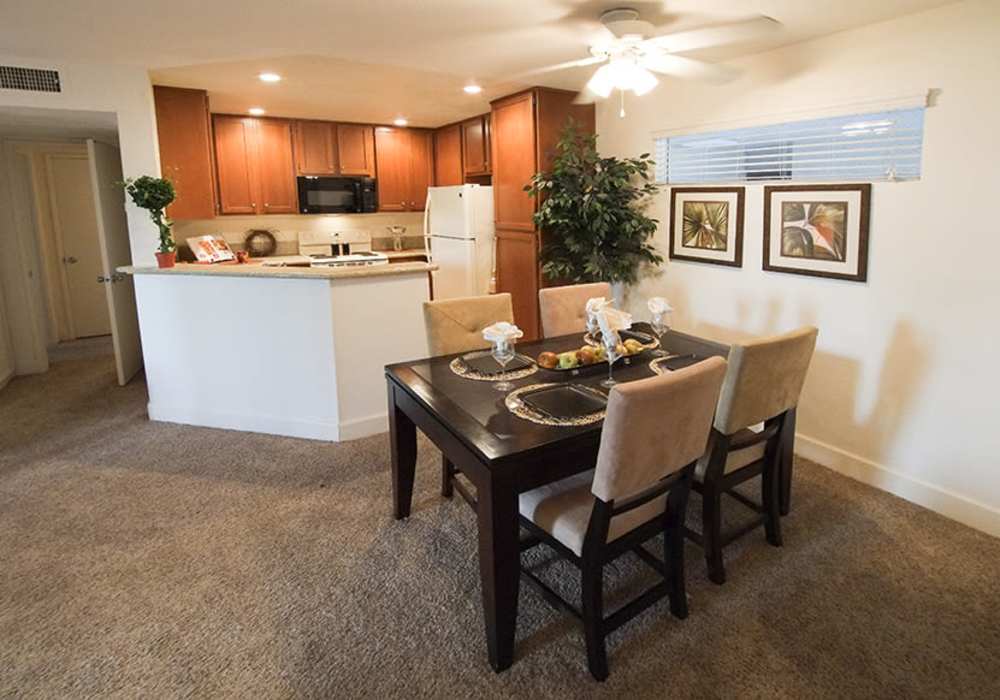 Welcoming dining area featuring plush seating, a stylish table at River Run Village in San Diego, California