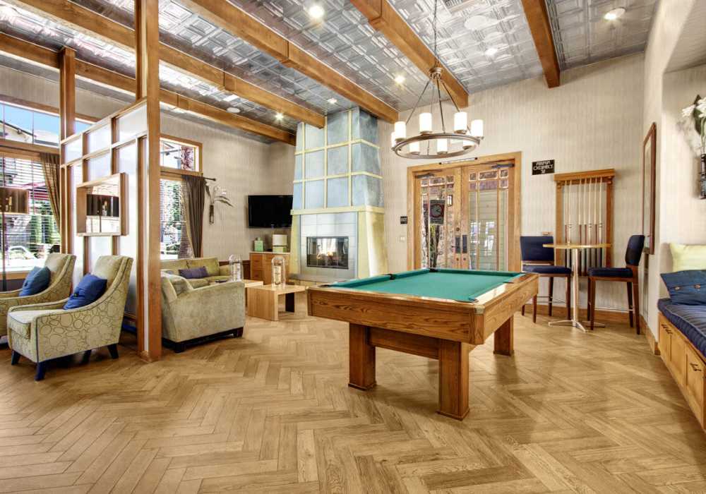 Community lounge area with fire place at Rivers Edge in Lake Elsinore, California