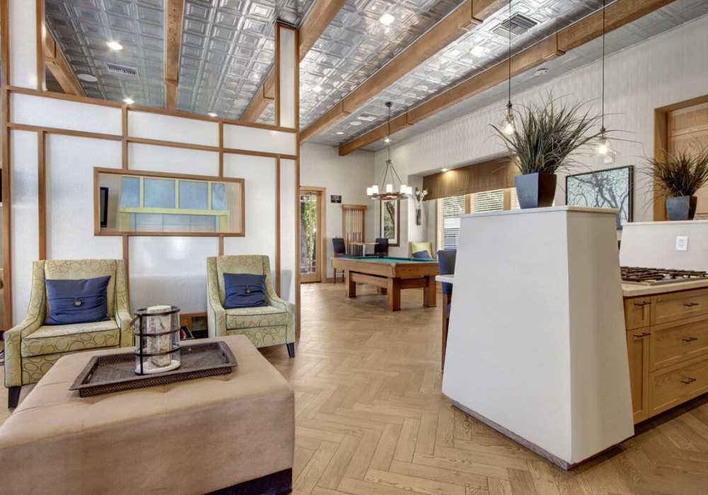 Upscale resident lounge area with tables and lots of seating at Rivers Edge in Lake Elsinore, California