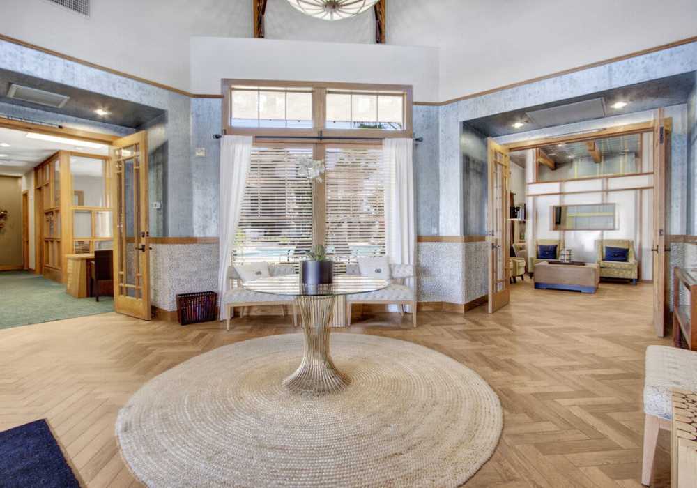 Upscale and large resident lounge with couches, tables at Rivers Edge in Lake Elsinore, California