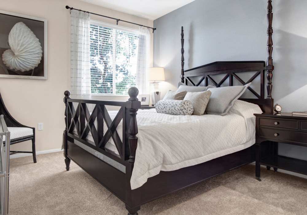 Spacious bedroom with large comfortable bed at Rivers Edge in Lake Elsinore, California