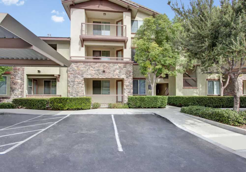 Exterior view of a building with parking at Rivers Edge in Lake Elsinore, California