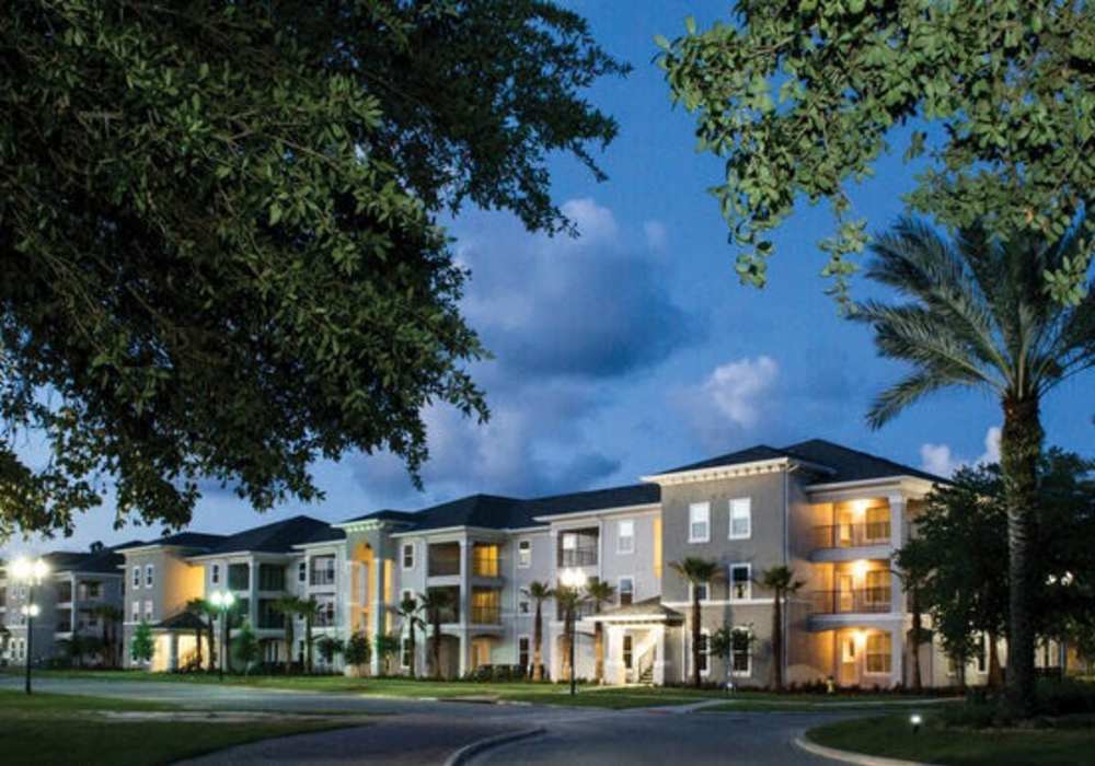 Night view of the buildings at Messina Luxury Apartments in New Smyrna Beach, Florida