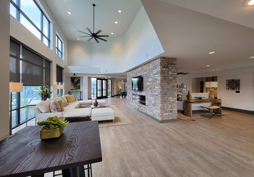 Spacious clubhouse with wooden style flooring at Messina Luxury Apartments in New Smyrna Beach, Florida