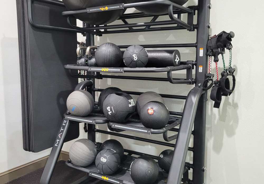 Weights in fitness center at Via Tuscany Apartments in Melbourne, Florida