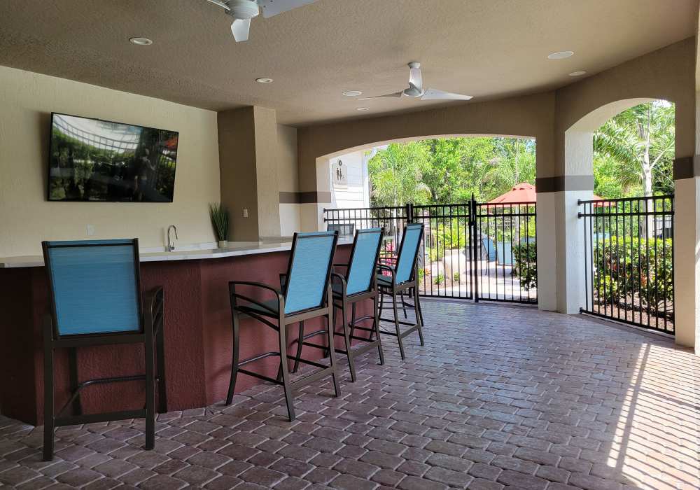 Community kitchen with granite countertops at Via Tuscany Apartments in Melbourne, Florida