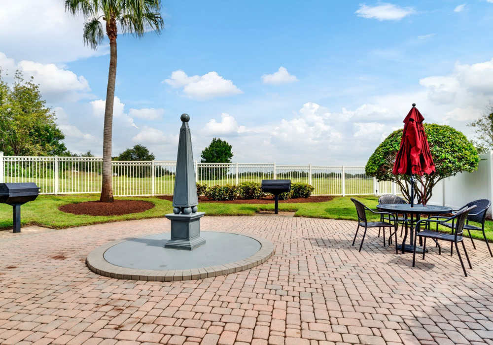 Outdoor seating area at Victoria Park Apartments in Davenport,Florida