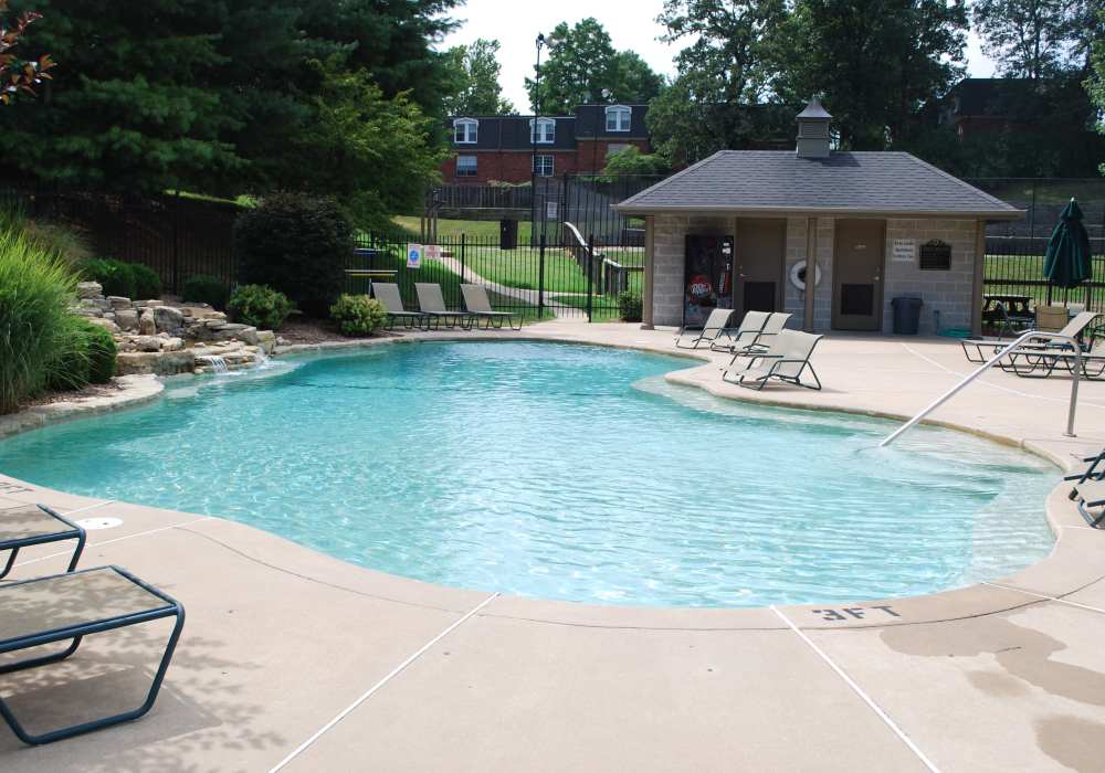 Swimming pool with lounge chairs at Beau Jardin Apartments in St. Louis, Missouri