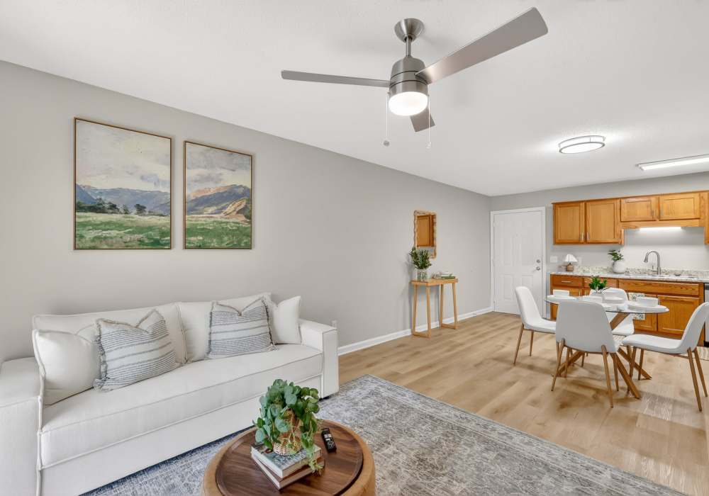 Modern-style living room with wooden furnishings at Saddlebrook Apartments in Murfreesboro, Tennessee