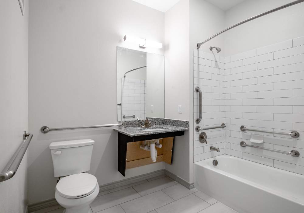 Bathroom with tub and shower at Terrace at Southern Oaks in Dallas, Texas