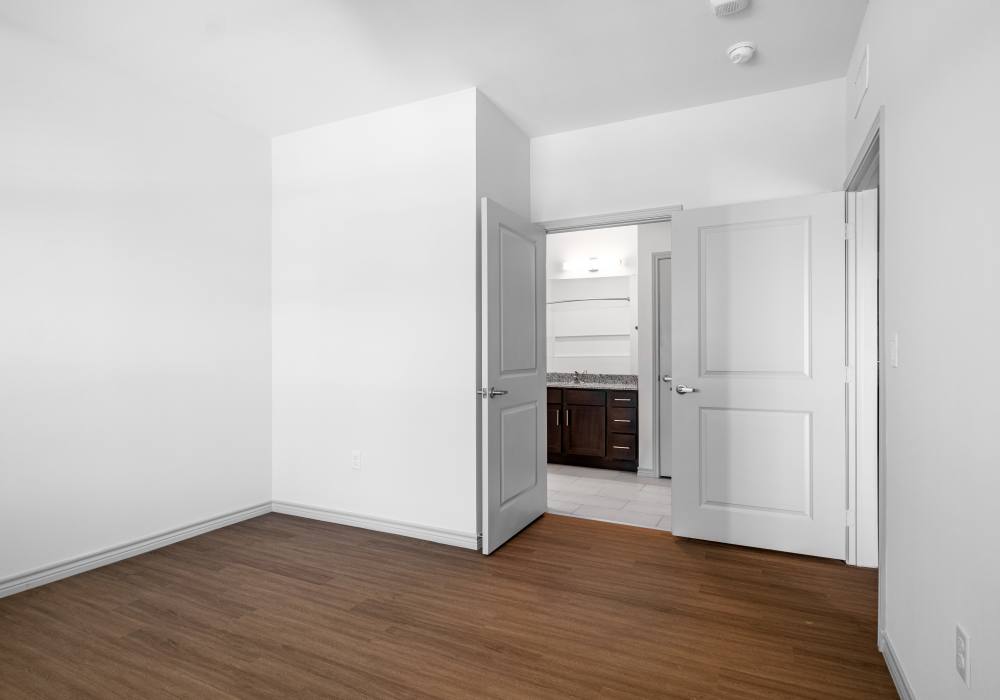 Bedroom with wood flooring at Terrace at Southern Oaks in Dallas, Texas