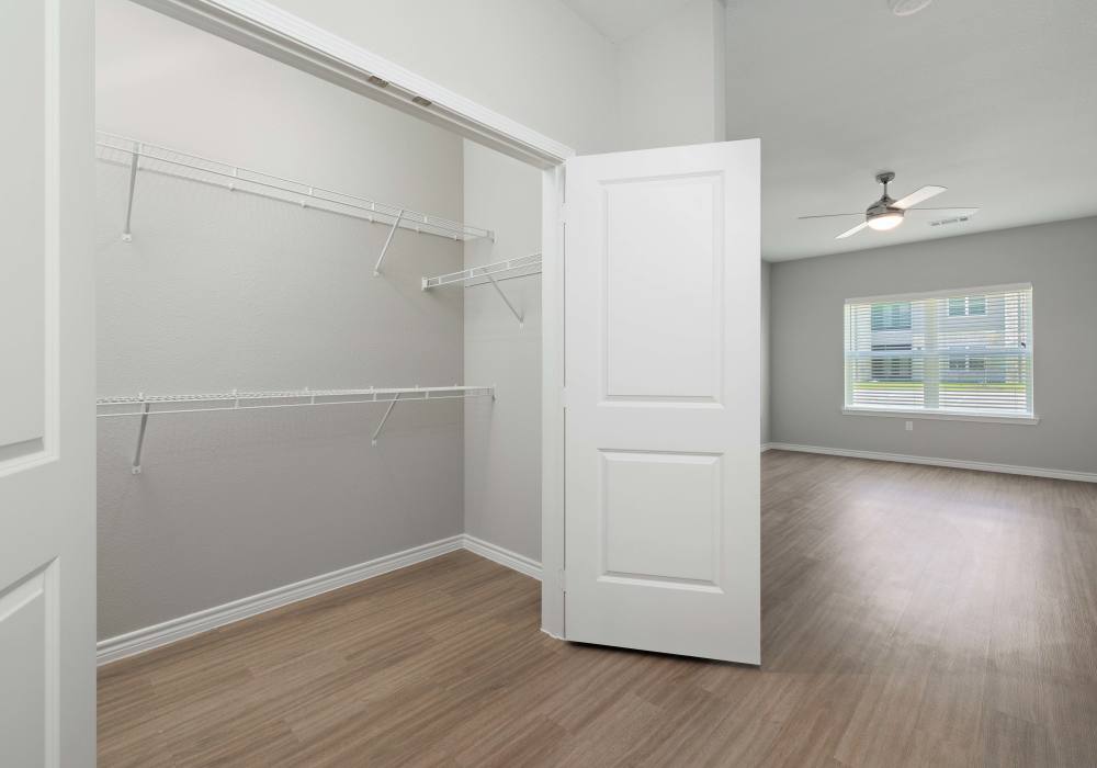Closet with multiple racks at Preserve at Gresham Lake in Raleigh,North Carolina
