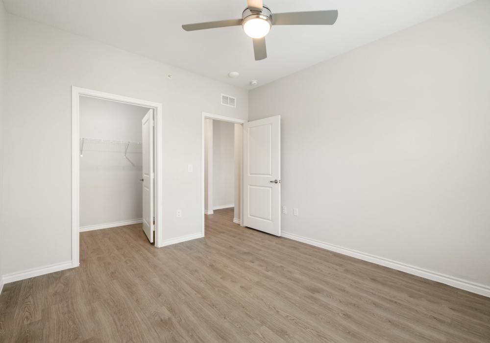 Unfurnished bedroom with walk-in closet at Preserve at Gresham Lake in Raleigh,North Carolina