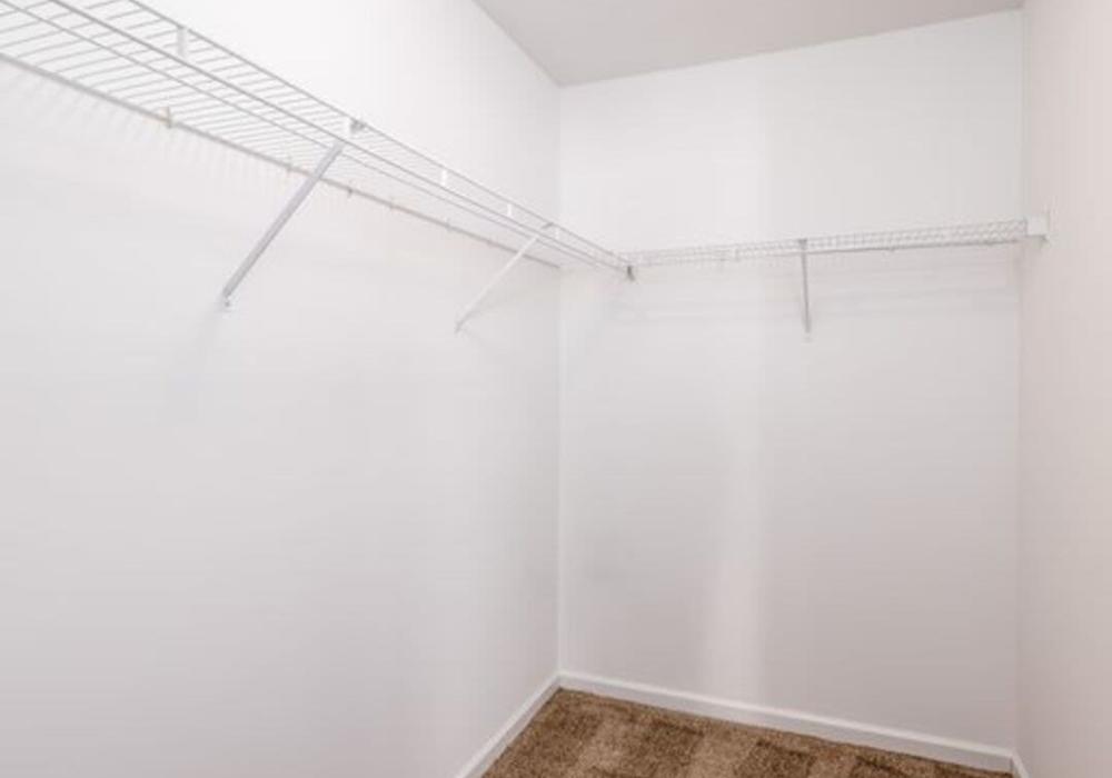 Closet in an apartment at Heritage Park Apartments & Townhomes in Webster, New York